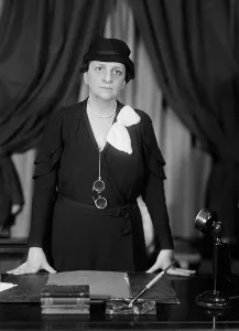 Brain Trust Prints: Labor Sec. Francis Perkins standing at her desk
