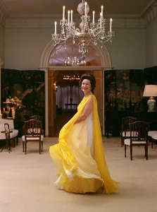 Draped Prints: Lady Bird Johnson in a flowing, multilayer yellow chiffon evening dress. May 8, 1968