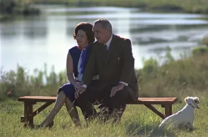 Lady Bird Prints: Lady Bird and President Johnson sit outdoors at the Pedernales River on the LBJ Ranch