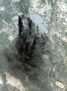Defenses Prints: Landsat image of Baghdad showing dark smoke plumes from pits of burning oil around the city center a tactic used to