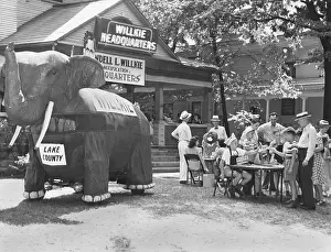 Indiana Prints: A large cloth elephant attacks shoppers to a souvenir stand at Elwood
