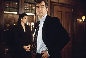 1990s Tv Prints: LAW & ORDER, from left: Angie Harmon (in background)