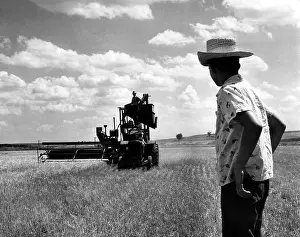 Texas Prints: L.B. Selleck stands on a combine