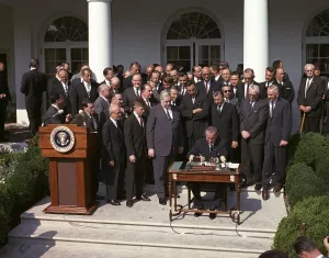 Social Programs Prints: LBJ's War on Poverty. President Lyndon Johnson signing the Poverty Bill (aka Economic Opportunity Act)