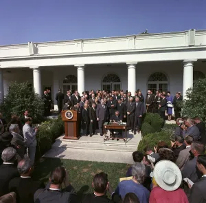 Social Programs Prints: LBJ's War on Poverty. President Lyndon Johnson signing the Poverty Bill (aka Economic Opportunity Act)