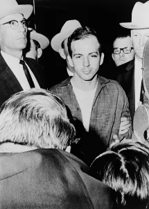 Dallas Prints: Lee Harvey Oswald escorted by officers at the Dallas Texas police headquarters shortly after his arrest for