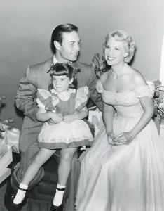 Dinah Prints: From left: George Montgomery, daughter Melissa Montgomery, wife Dinah Shore, July 1, 1953