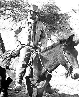 Stirrups Prints: LEGEND OF THE LOST, John Wayne, 1957