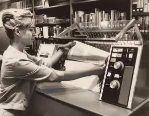 Progress Prints: Librarian taking a printout from a UNIVAC 490 Printer