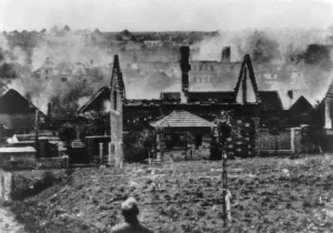 Mass Murder Prints: Lidice, Czechoslovakia in flames in June 1942, during World War 2