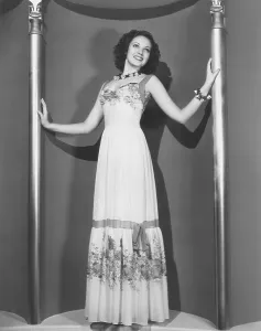 Darnell Prints: Linda Darnell in a white chiffon dance dress, 1939