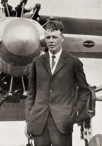 Lindbergh, Charles A. (1902-1974). Portrait of Lindbergh with his monoplane "Spirit of Saint Louis", with which he made the crossing from New York to Paris