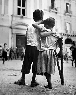 Disabled Prints: Little boy helps one-legged companion across street