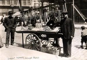 Ethnic Prints: Little Italy - Street vendor with wares displayed on a handcart during a festival