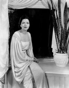 Full Sleeves Prints: LIVING ON VELVET, Kay Francis, in a white wool-crepe dress dotted with rhinestones
