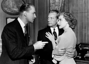 Accusing Prints: THE LOCKET, from left, Brian Aherne, Gene Raymond, Laraine Day, 1946