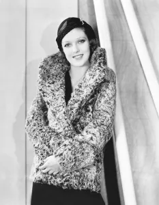 Images Dated 10th February 2014: Loretta Young in grrey curly caracul sports coat and black hat, 1932