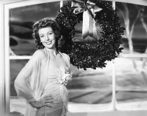 Christmas Prints: Loretta Young in Universal studio portrait greets the holiday season, 1943