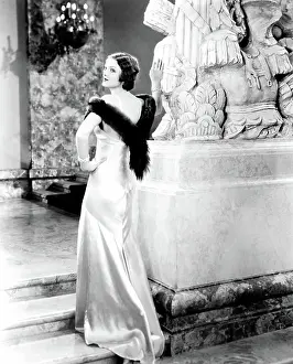 LOVE ME TONIGHT, Myrna Loy (in a gown by Travis Banton), 1932