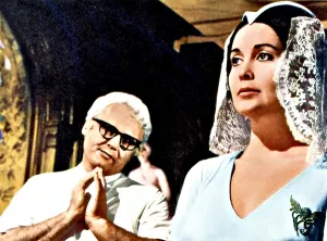 Hands Clasped Prints: THE LOVED ONE, Rod Steiger, Anjanette Comer, 1965