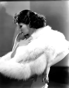 Cape Prints: Lupe Velez wearing white fox cape, ca. 1934