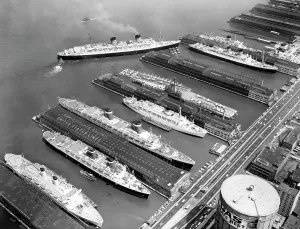 From Above Prints: Luxury liners flanking an aircraft carrier at piers along the West Side Highway