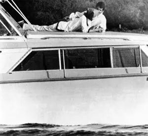 Lynda Bird Prints: Lynda Bird Johnson relaxes on her father's cabin cruiser with her weekend guest