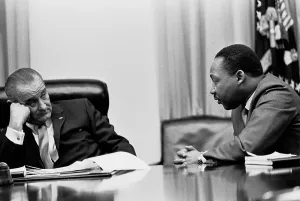 Domestic Politics Prints: Lyndon Johnson listening to Martin Luther King during a meeting with civil rights leaders at the White House