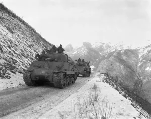 Un Offensive Prints: M-4A3 Sherman tank convoy travels along a well graded but narrow road coming up Funchilin Pass on Nov