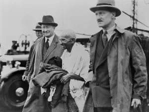 Revolutionaries Prints: Mahatma Gandhi escorted to his automobile by two detectives. He arrived at Folkstone, U.K