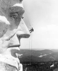 Images Dated 19th April 2007: A maintenance worker on the nose of Mount Rushmore's Abraham Lincoln