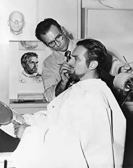 Films Prints: Makeup artist Ben Nye working on actor Douglas Fairbanks, Jr. Ca. 1940s. (CSU_2015_8_487)