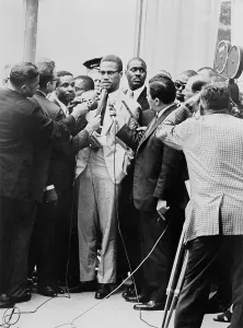 Militants Prints: Malcolm X being interviewed by reporters in New York, 1964