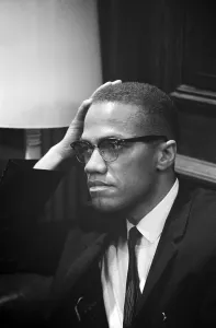 Civil Rights Prints: Malcolm X, Malcolm X waits at Martin Luther King press conference, 1964
