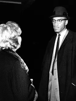 Reporter Prints: Malcolm X talks to a woman reporter following his television appearance in New York City