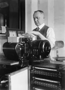Punch Cards Prints: Man loading punch cards into a tabulating machine used in the 1920 United States census