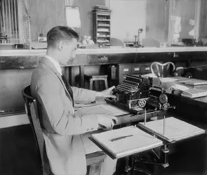 Images Dated 18th February 2011: Man operating a Post Office money order machine. Ca. 1930. (BSLOC_2010_18_49)