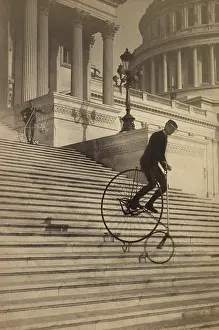 Bicycle Prints: Man riding a penny-farthing bicycle down the Capitol steps in 1884