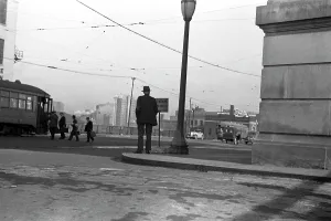 Nebraska Prints: Man standing on corner, 6:30 a