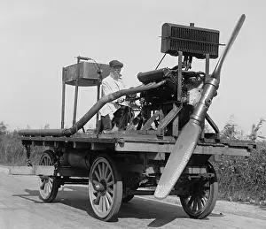 Road Prints: Man on wheeled vehicle with mounted propeller