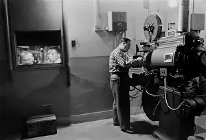Marions Prints: Man working a projector in a movie theater, photo by Marion S. Trikosko, February 9, 1958