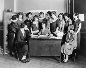 Morality Prints: Margaret Sanger, birth control pioneer at a desk surround by twelve other women in 1924