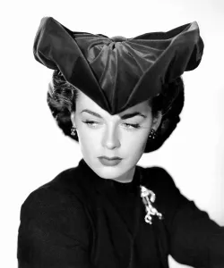 Marguerite Prints: Marguerite Chapman, modeling an ultra chic miracle hat that can be molded into different shapes