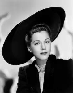 Picture Hat Prints: Maria Montez, modeling a black felt and velvet hat by Jacques Fath, 1946