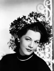Maria Prints: Maria Montez, modeling a violet-colored straw bonnet trimmed with violets, 1946