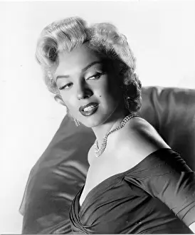 1409mam Prints: Marilyn Monroe, in a photo sitting for MONKEY BUSINESS