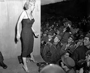 Movie Stars Prints: Marilyn Monroe, poses for the army shutterbugs after a performance at the 3rd U