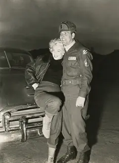 Movie Stars Prints: Marilyn Monroe poses with a U.S