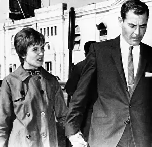 Holding Hands Prints: Marina Oswald Porter and Kenneth Porter on their way to a grand jury hearing in New Orleans