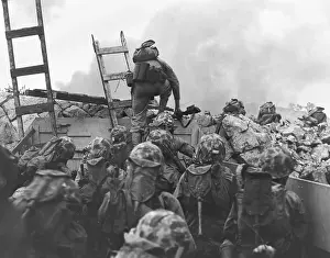 Seawall Prints: Marine Lt. Baldomero Lopez scaling a seawall after landing on Red Beach in the invasion of Inchon
